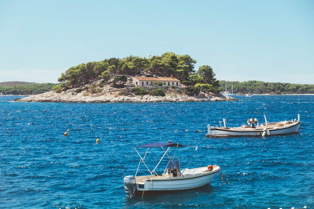 Boats Near Island in Bay of Adriatic Sea in Croatia
